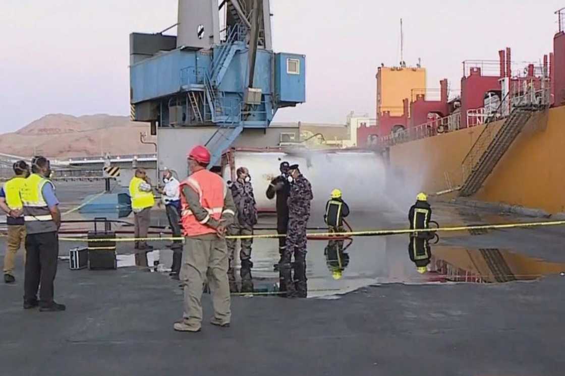 Footage on state TV showed a large cylinder plunging from a crane on a moored vessel in Jordan's Aqaba port, causing a violent explosion of yellow gas Footage on state TV showed a large cylinder plunging from a crane on a moored vessel in Jordan's Aqaba port, causing a violent explosion of yellow gas