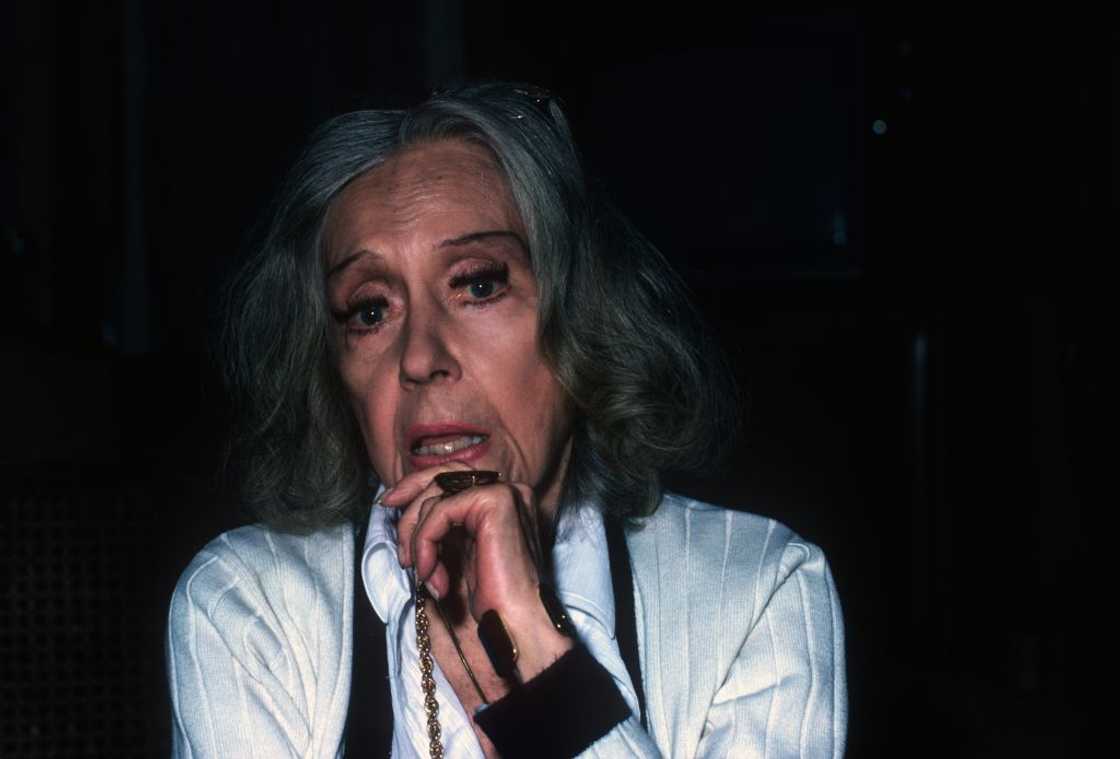 Gloria Swanson at home posing for a photo in New York Gloria Swanson at home posing for a photo in New York