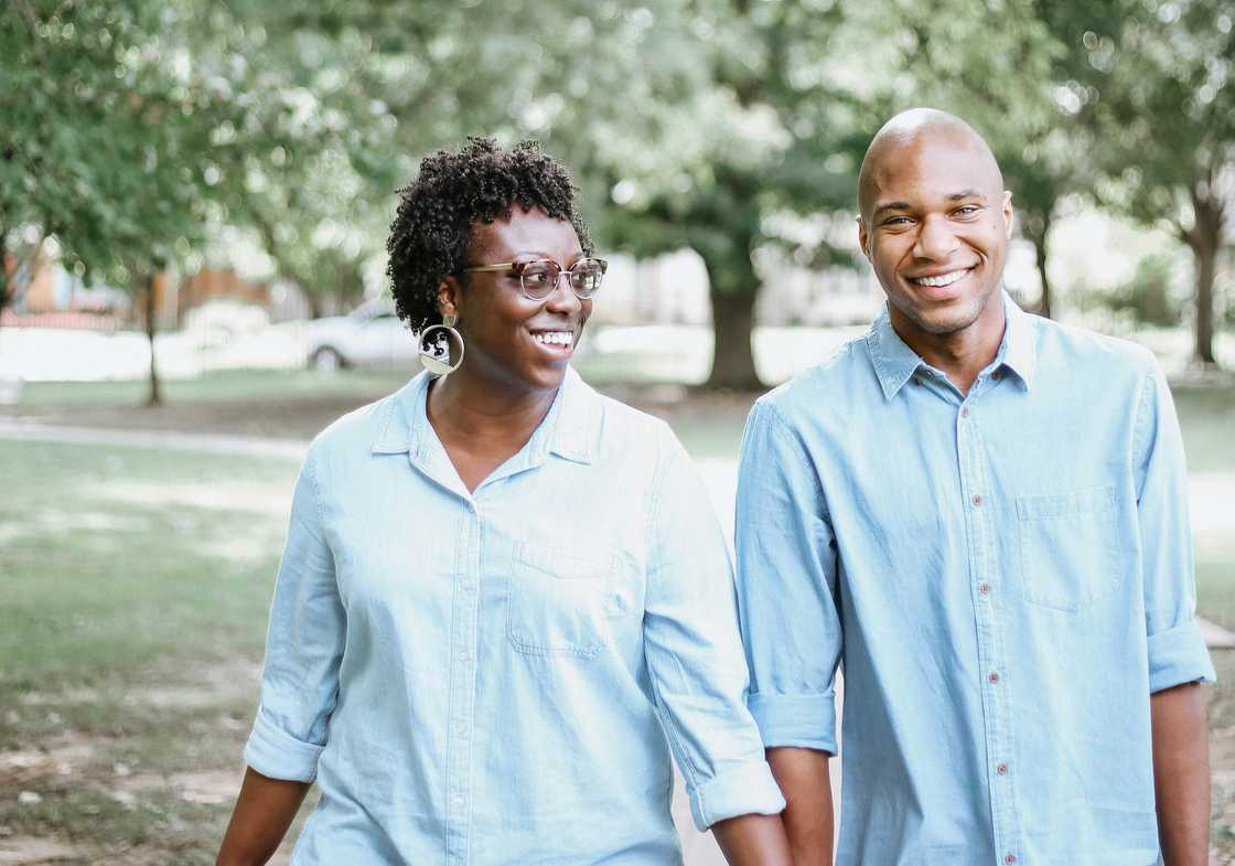 Two friends walking together in a park