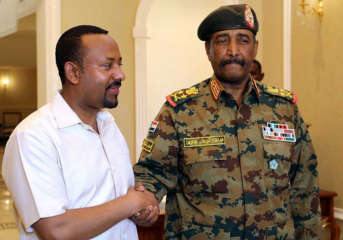 Ethiopian Prime Minister Abiy Ahmed (left) is pictured with Sudan's military leader Abdel Fattah al-Burhan in Khartoum in 2019 Ethiopian Prime Minister Abiy Ahmed (left) is pictured with Sudan's military leader Abdel Fattah al-Burhan in Khartoum in 2019
