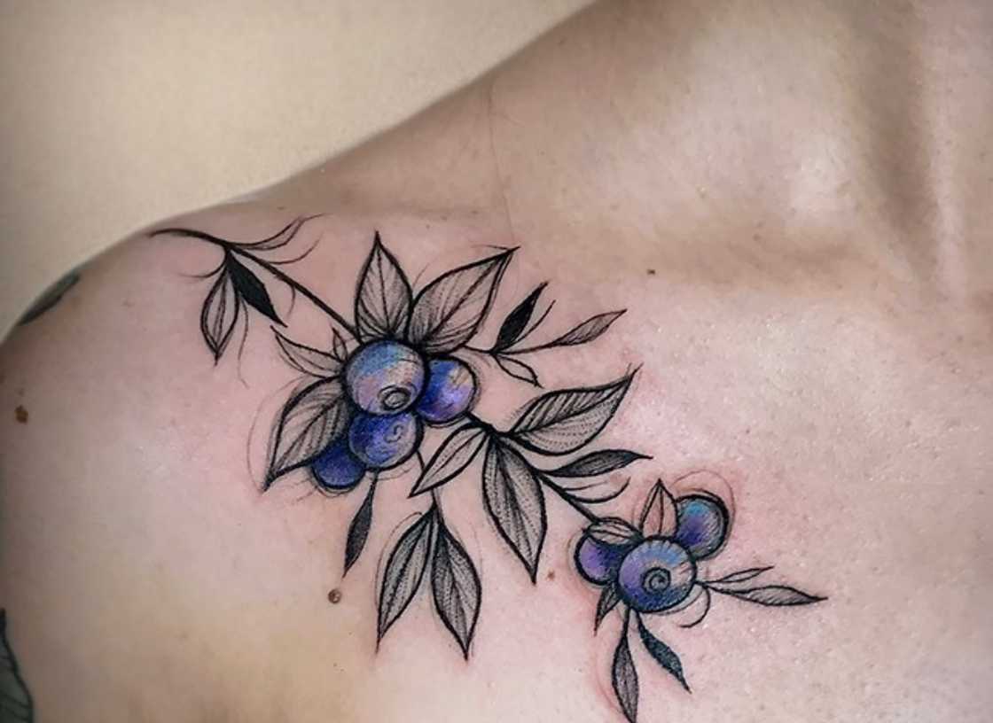 Blueberries and flower tattoo