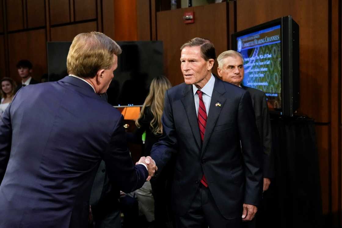 US Senator Richard Blumenthal shakes hands with Chief Operating Officer of the PGA Tour Ron Price during a Senate subcommittee hearing examining the business deal between the PGA Tour and the Public Investment Fund of Saudi Arabia, backers of LIV Golf