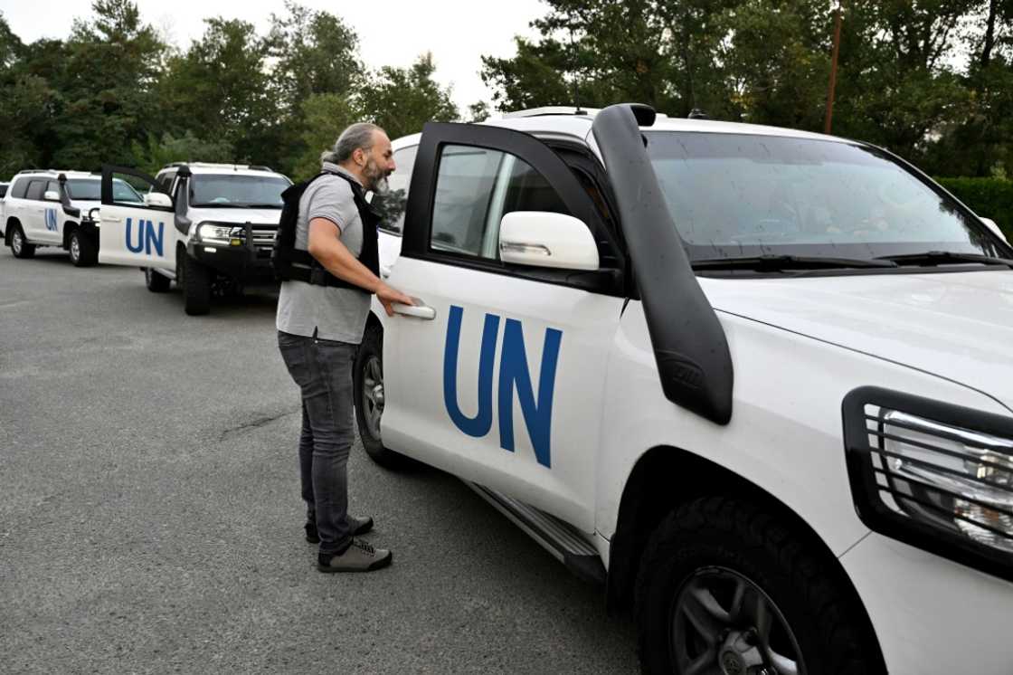 United Nations vehicles carry inspectors around the Russian-held Zaporizhzhia nuclear plant in Ukraine on September 1, 2022 United Nations vehicles carry inspectors around the Russian-held Zaporizhzhia nuclear plant in Ukraine on September 1, 2022