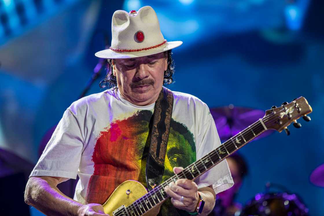 Guitarist Carlos Santana of Santana performs on stage at North Island Credit Union Amphitheatre Guitarist Carlos Santana of Santana performs on stage at North Island Credit Union Amphitheatre