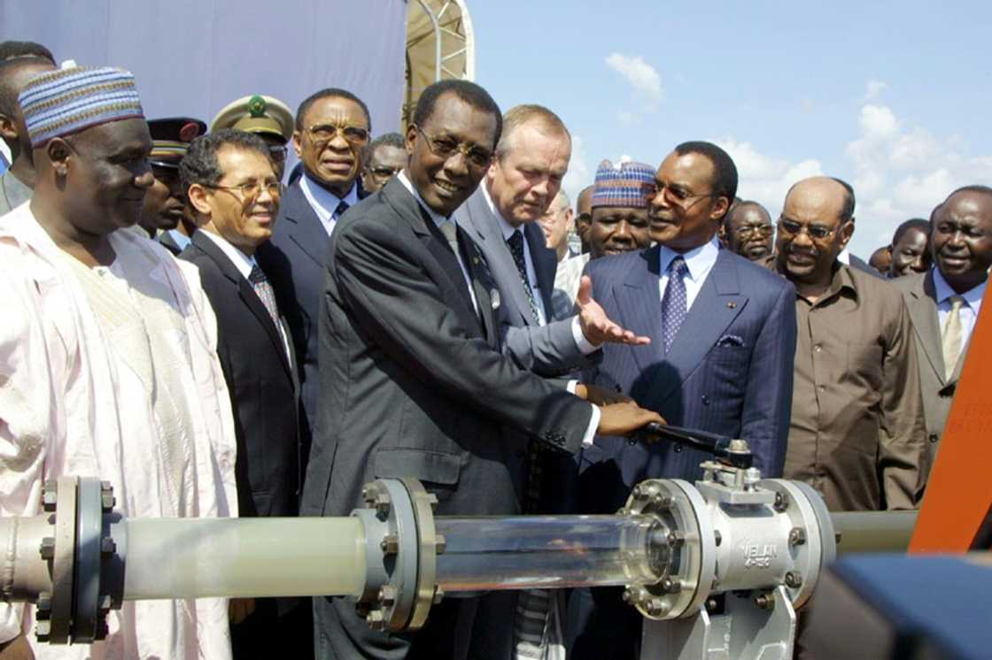The 1,000-kilometre (600-mile) pipeline from Chad to Cameroon was launched in 2003 by then-president Idriss Deby Itno, centre The 1,000-kilometre (600-mile) pipeline from Chad to Cameroon was launched in 2003 by then-president Idriss Deby Itno, centre