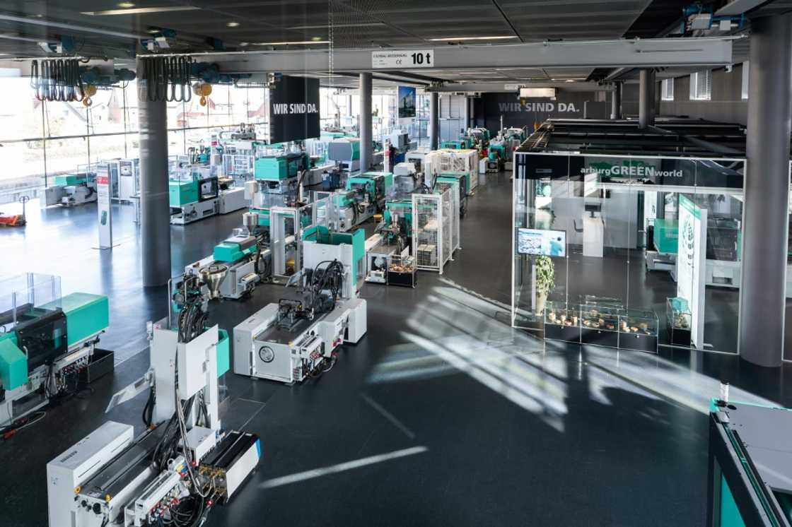 The firm makes machines that produce plastic parts in sectors from the auto industry to electronics and packaging -- hulking high-tech marvels that weigh up to 40 tons The firm makes machines that produce plastic parts in sectors from the auto industry to electronics and packaging -- hulking high-tech marvels that weigh up to 40 tons