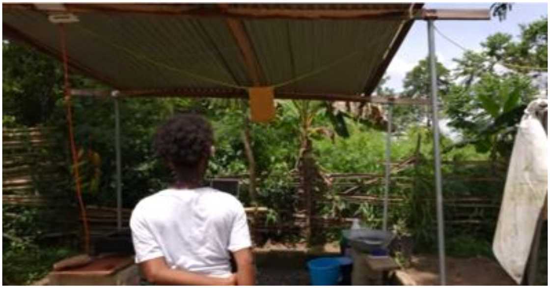 The girl stares at a structure that serves as their kitchen