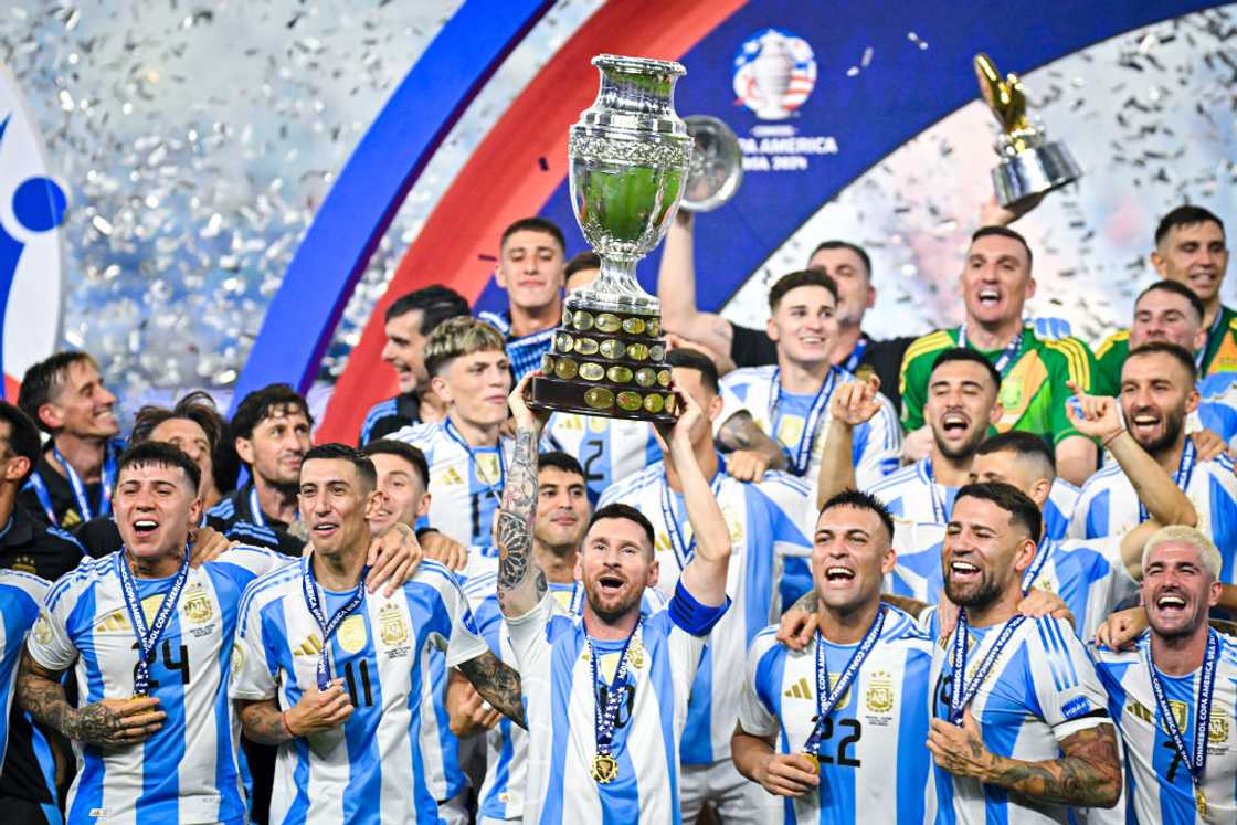 Lionel Messi lifts the Copa America trophy. Lionel Messi lifts the Copa America trophy.