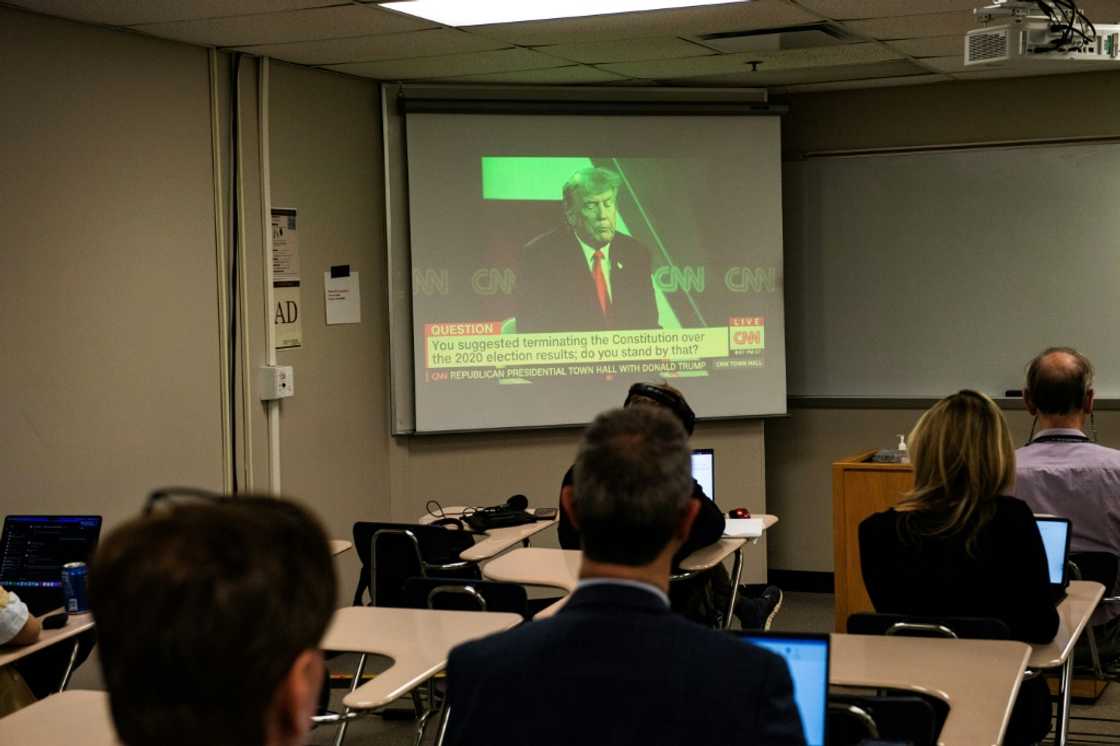 Reporters watch a CNN town hall with former US president and 2024 Republican hopeful Donald Trump at St. Anselm College in New Hampshire Reporters watch a CNN town hall with former US president and 2024 Republican hopeful Donald Trump at St. Anselm College in New Hampshire