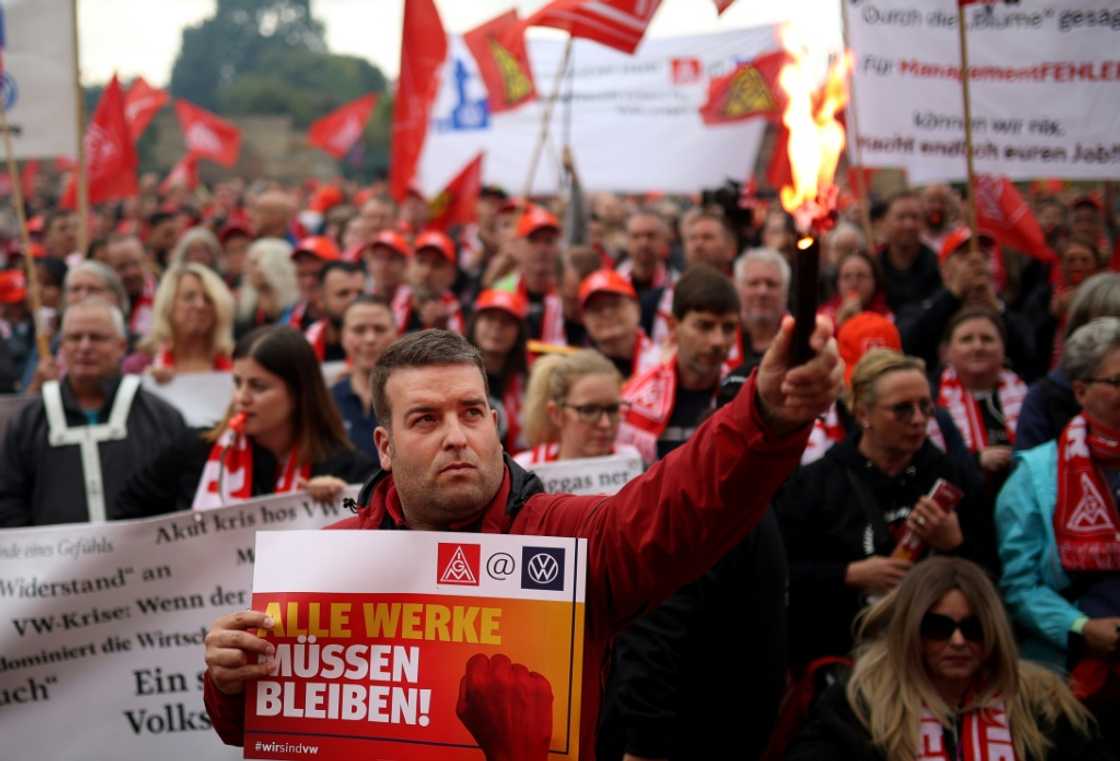 IG Metall union members demonstrate in Hanover, where talks with Volkswagen's management are to start