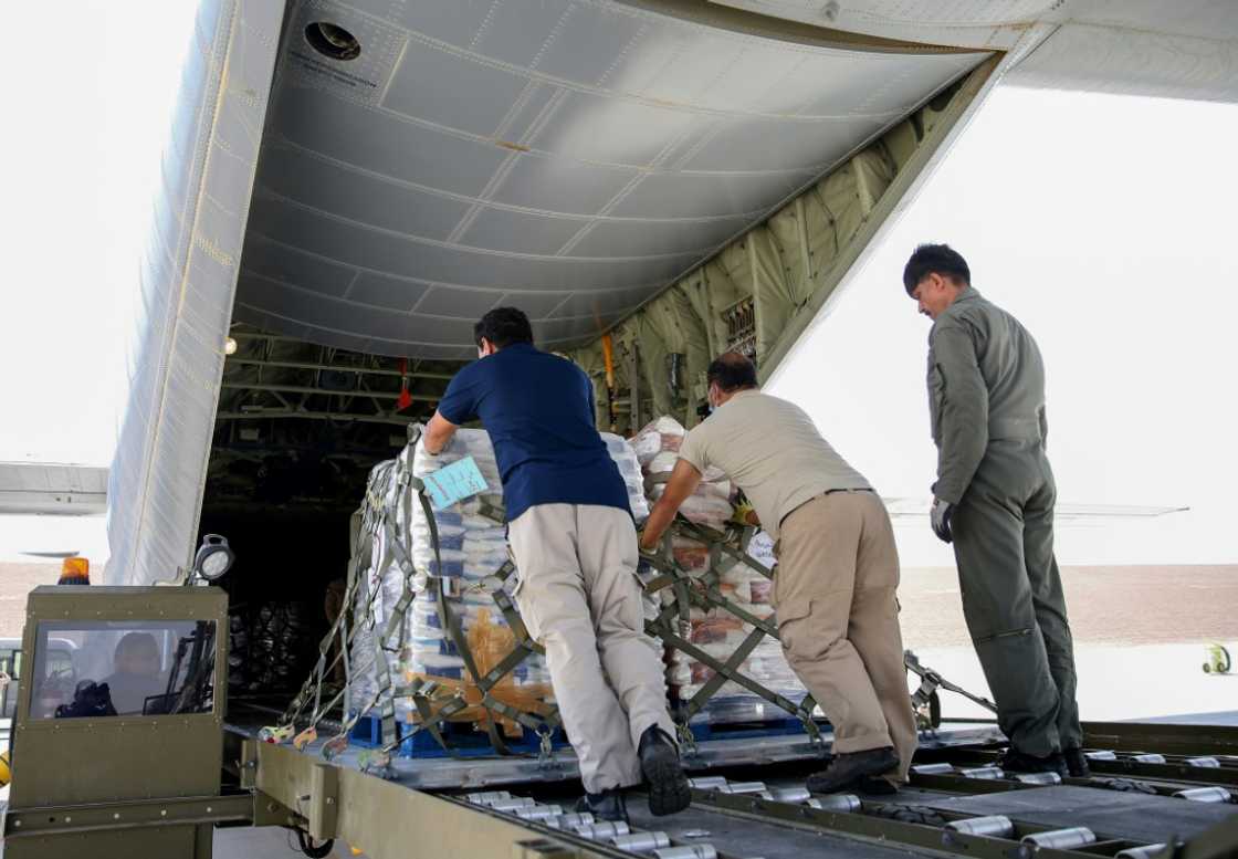 Relief supplies are loaded onto an aircraft at Al-Udeid airbase in Qatar for delivery to Afghanistan Relief supplies are loaded onto an aircraft at Al-Udeid airbase in Qatar for delivery to Afghanistan