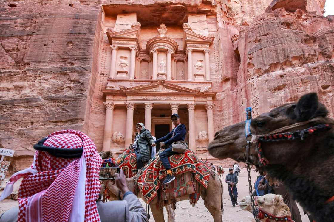 Famous for its stunning structures hewn out of the rose-pink cliff faces, Petra is a United Nations World Heritage site Famous for its stunning structures hewn out of the rose-pink cliff faces, Petra is a United Nations World Heritage site