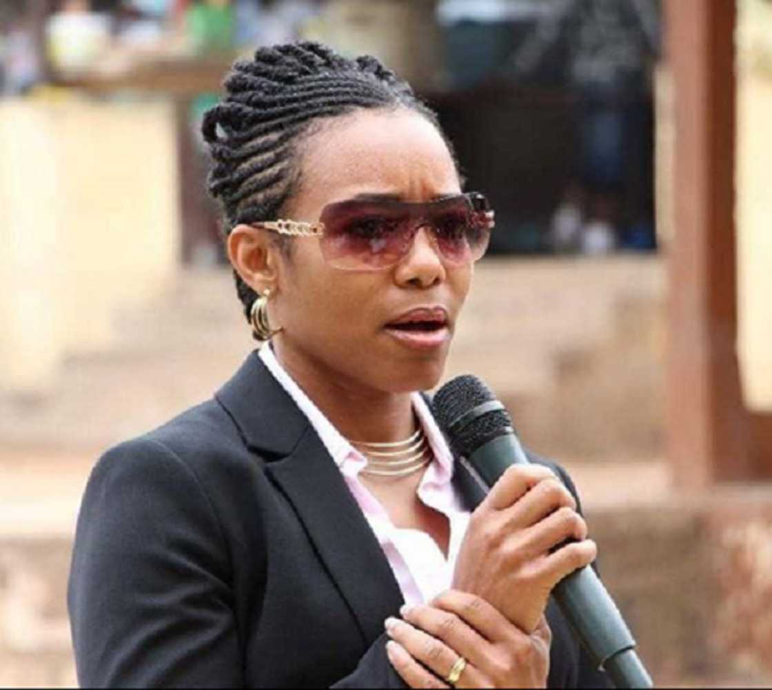 A woman holding a microphone A woman holding a microphone