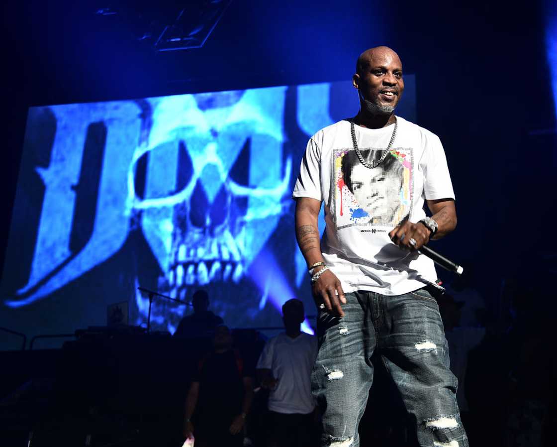 DMX performs in a white tee, denim jeans, and silver jewerellery. DMX performs in a white tee, denim jeans, and silver jewerellery.