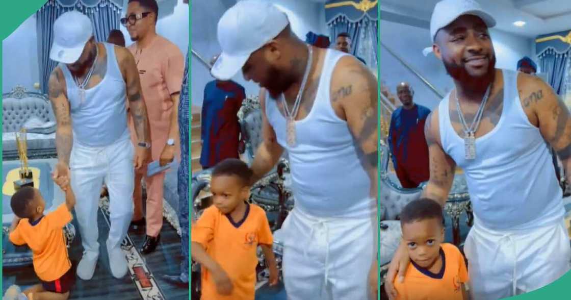 Boy kneels to greet Davido.