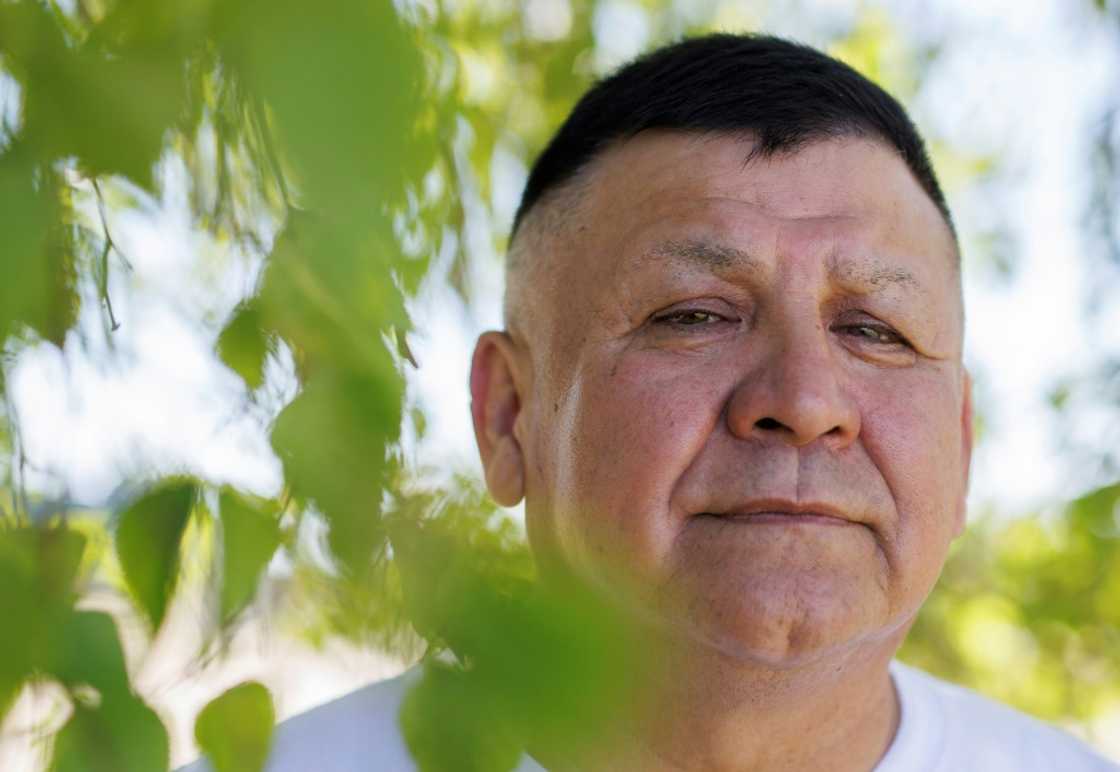 Randy Ermineskin, chief of Ermineskin Cree Nation, poses by a birch tree on June 7 in the Indigenous community of Maskwacis, Alberta. He sat down with AFP to share views and expectations for Pope Francis's end of July visit to Canada in which he is to offer apologies for more than a century of abuses at Indigenous residential schools