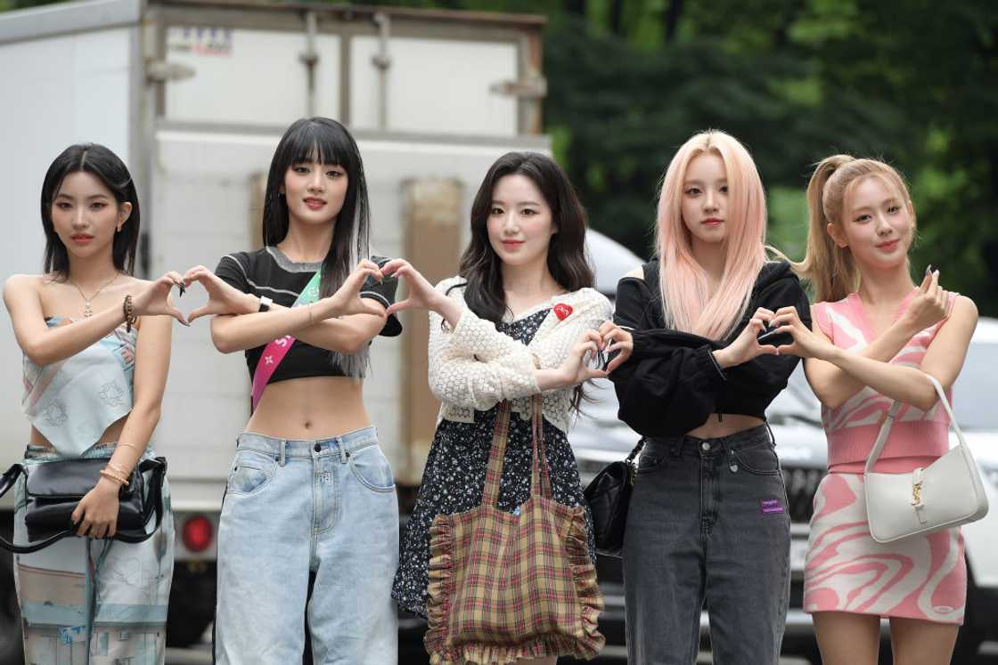 GI-DLE, one of the most popular K-pop groups internationally, pose for a photo, making love heart patterns. GI-DLE, one of the most popular K-pop groups internationally, pose for a photo, making love heart patterns.
