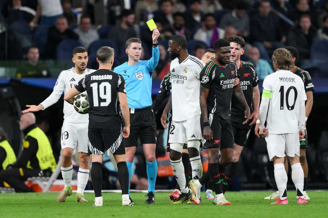 Referee Francois Letexier shows a yellow card to Thomas Partey of Arsenal during the UEFA Champions League 2024/25 Quarter Final Second Leg match between Real Madrid C.F. and Arsenal FC at Estadio Santiago Bernabeu on April 16, 2025 in Madrid, Spain Referee Francois Letexier shows a yellow card to Thomas Partey of Arsenal during the UEFA Champions League 2024/25 Quarter Final Second Leg match between Real Madrid C.F. and Arsenal FC at Estadio Santiago Bernabeu on April 16, 2025 in Madrid, Spain