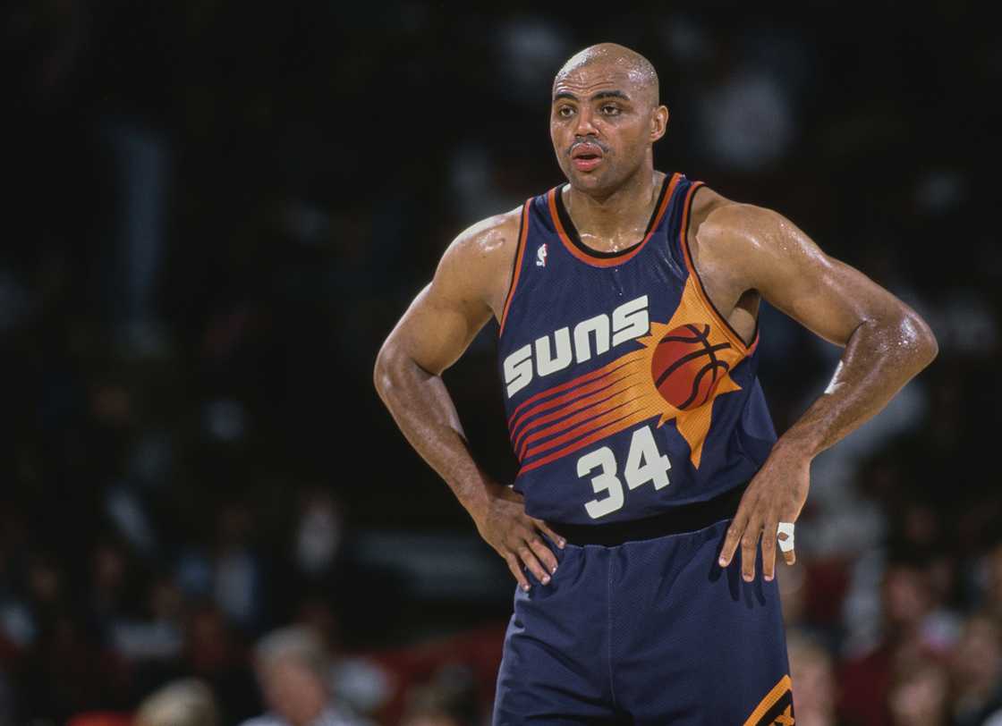 Charles Barkley looks on with hands on hips during the NBA Midwest Division basketball game against the Denver Nuggets at the McNichols Sports Arena in Denver
