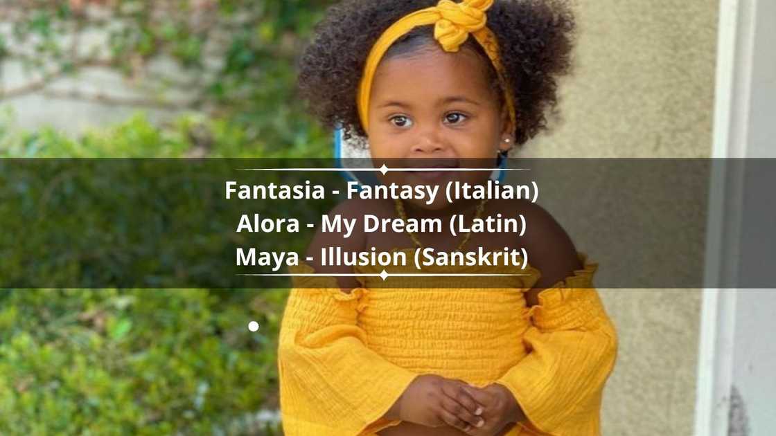 A mixed race girl in a yellow summer rummper. A mixed race girl in a yellow summer rummper.