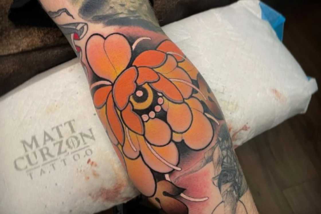 A colourful peony elbow tattoo A colourful peony elbow tattoo