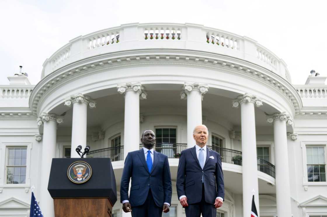 US President Joe Biden (R) and Kenya's President William Ruto stand as national anthems are played during an official arrival ceremony on the South Lawn of the White House in Washington, DC US President Joe Biden (R) and Kenya's President William Ruto stand as national anthems are played during an official arrival ceremony on the South Lawn of the White House in Washington, DC
