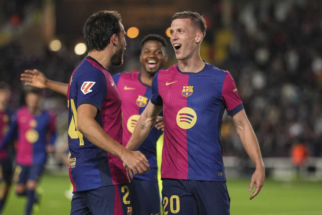 Dani Olmo of FC Barcelona celebrates with team mates after scoring the team's first goal during the La Liga EA Sports match between FC Barcelona and RCD Mallorca at Estadi Olimpic Lluis Companys on April 22, 2025 in Barcelona, Spain Dani Olmo of FC Barcelona celebrates with team mates after scoring the team's first goal during the La Liga EA Sports match between FC Barcelona and RCD Mallorca at Estadi Olimpic Lluis Companys on April 22, 2025 in Barcelona, Spain