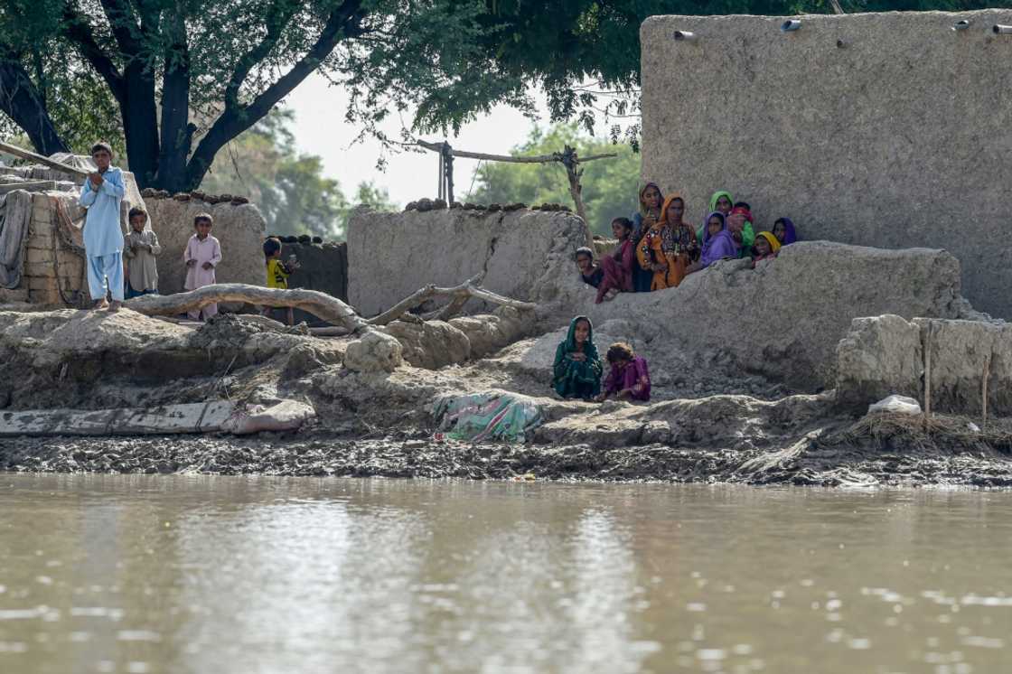 Many people are stranded in isolated hamlets above a landscape of water in the south and west Many people are stranded in isolated hamlets above a landscape of water in the south and west