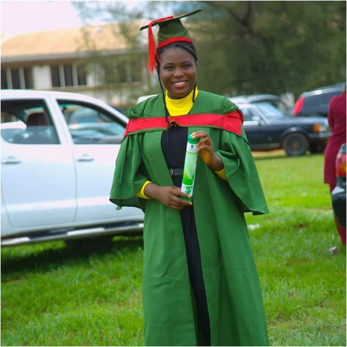 Sarah smiles in her UNN graduation gown. Sarah smiles in her UNN graduation gown.