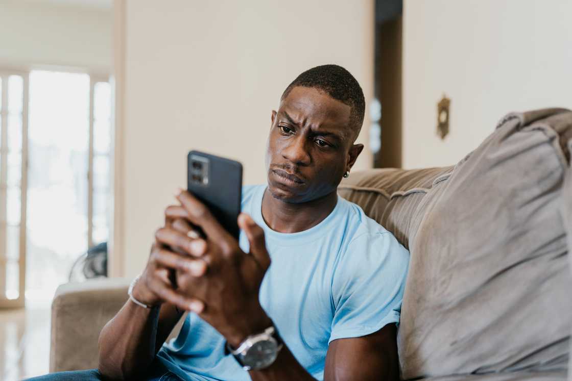 A man is holding a phone