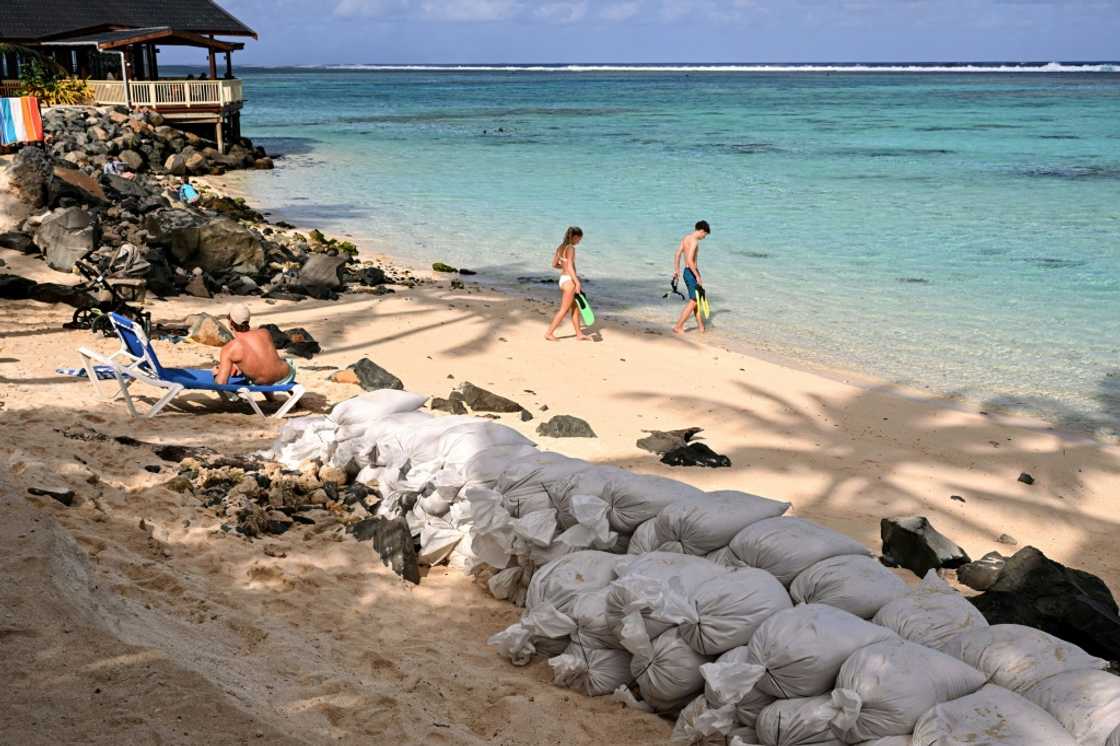 The Cook Islands' pistine lagoons lure wealthy tourists that prop-up the economy, fridges are stocked with fish plucked from vibrant reefs, and local myths teach children to revere the sea