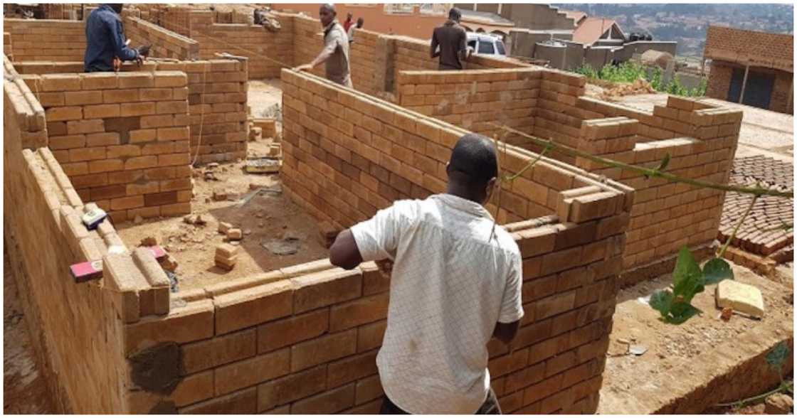 People building a house