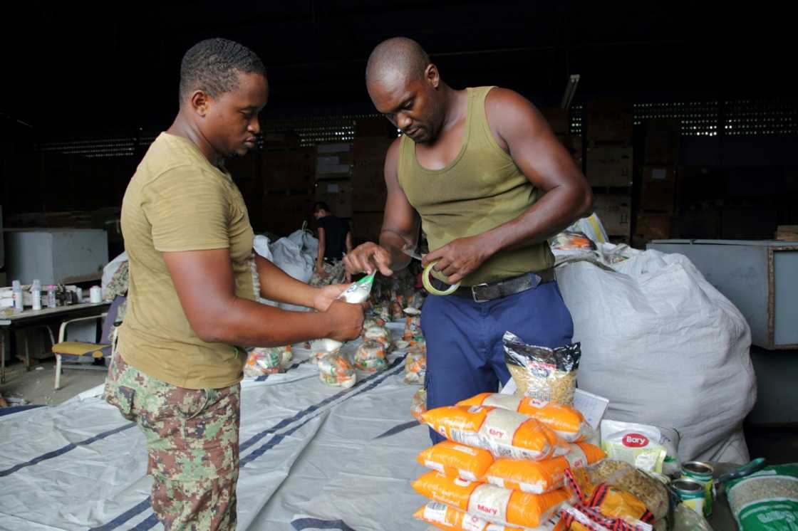 Soldiers pack food supplies after receiving a 40,000 tons of aid from Venezuela Soldiers pack food supplies after receiving a 40,000 tons of aid from Venezuela