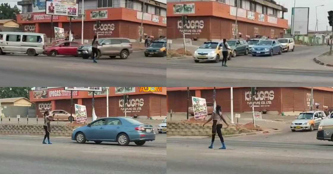 Female Pure Water Seller Directs Traffic Like A Pro After Power Outage in Kumasi; Ghanaians Praise Her (Video)