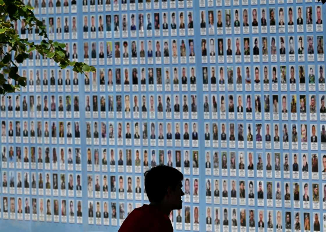 A memorial wall in Kyiv displays images of Ukrainian troops killed since Russia's invasion A memorial wall in Kyiv displays images of Ukrainian troops killed since Russia's invasion