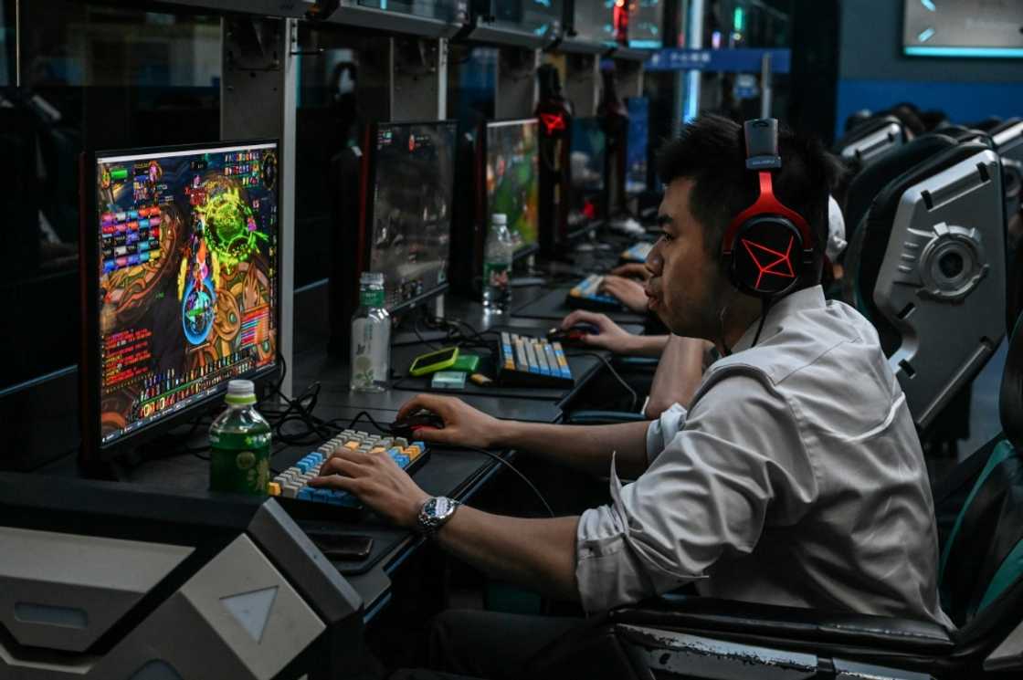 At an internet cafe in the capital Beijing, gamers tapped furiously on multicoloured keyboards