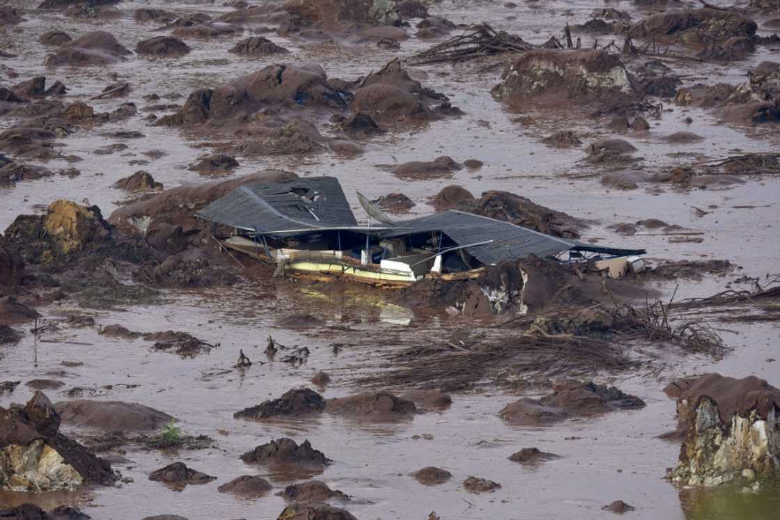 The dam collapse triggered a giant mudslide that swamped villages, rivers and rainforest, killing 19 people The dam collapse triggered a giant mudslide that swamped villages, rivers and rainforest, killing 19 people
