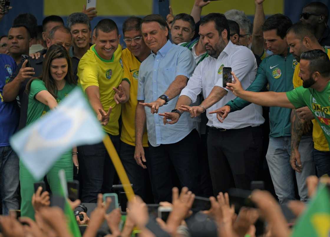 Bolsonaro greets supporters at a rally Bolsonaro greets supporters at a rally