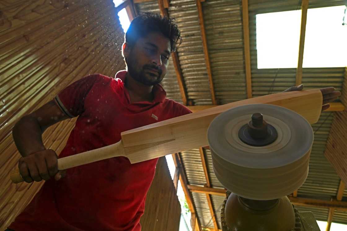A worker crafts a Kashmiri willow wood cricket bat at a factory in Kashmir's Sangam village, on August 19, 2023 A worker crafts a Kashmiri willow wood cricket bat at a factory in Kashmir's Sangam village, on August 19, 2023