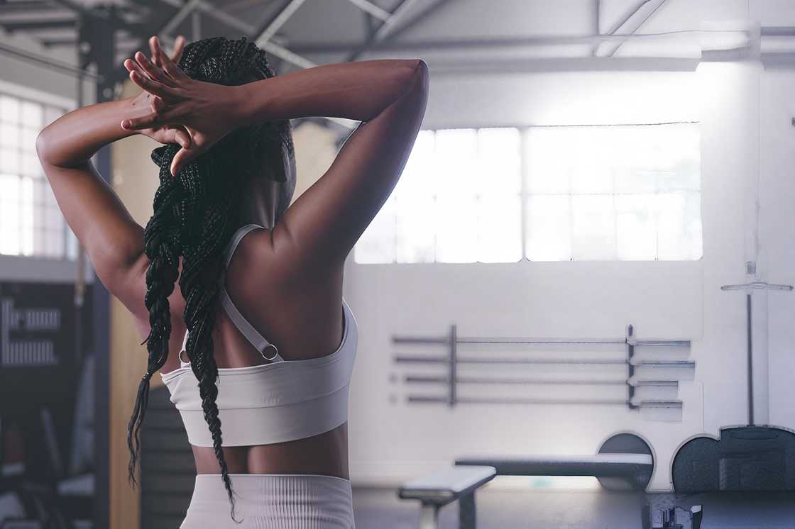 A black woman stands in a gym A black woman stands in a gym