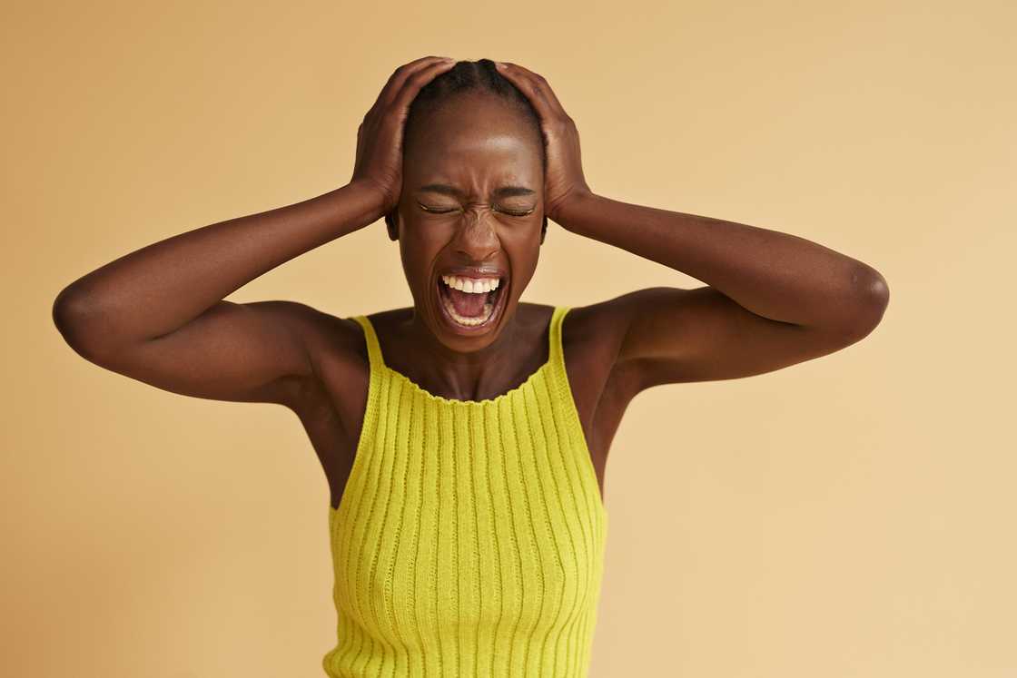 A woman in a yellow top A woman in a yellow top