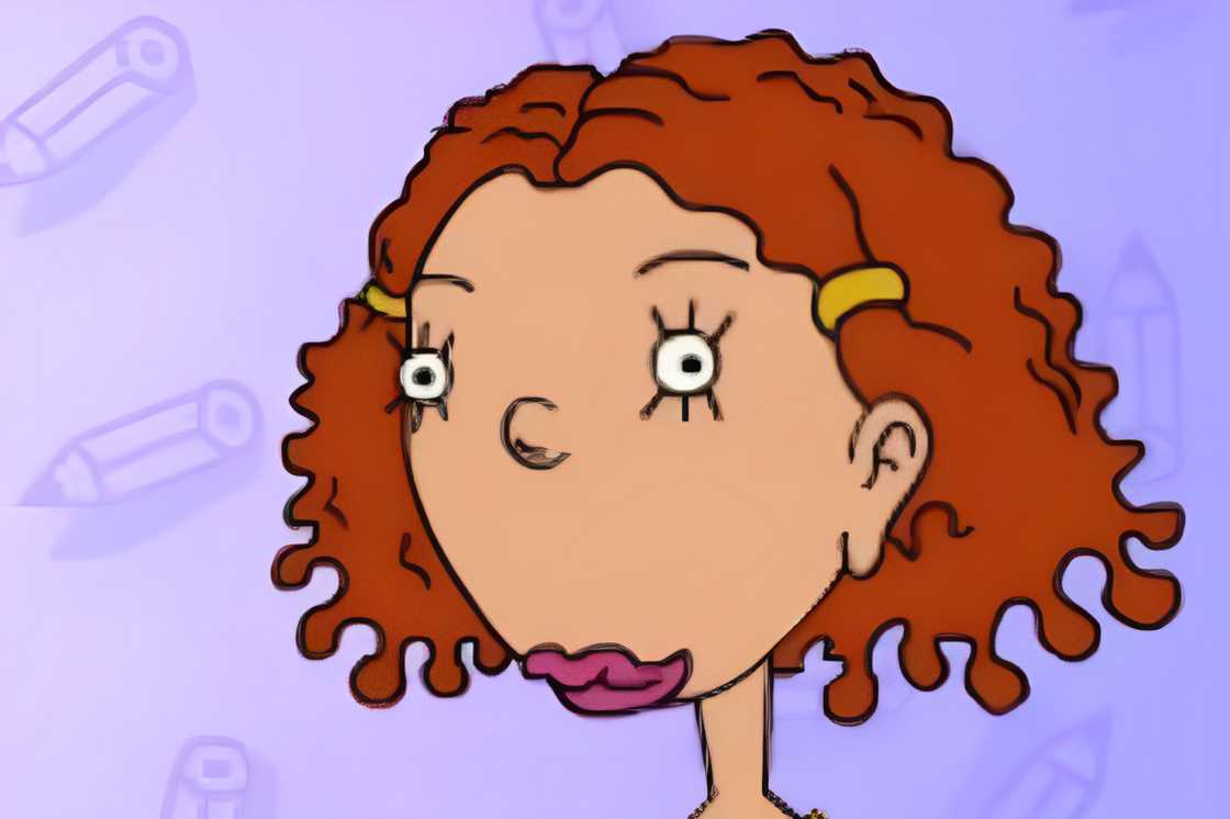 Ginger Foutley is standing against a blue background with pens Ginger Foutley is standing against a blue background with pens