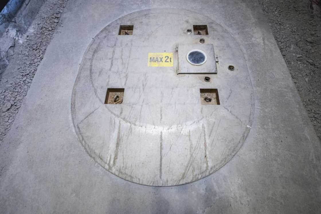 Nuclear waste is stored in holes covered by lids such as these Nuclear waste is stored in holes covered by lids such as these