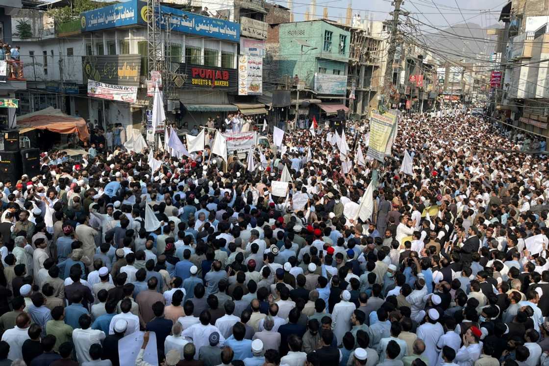 People take part in a protest a day after an attack on a school bus in Mingora, in the Swat District of Khyber Pakhtunkhwa in October. People take part in a protest a day after an attack on a school bus in Mingora, in the Swat District of Khyber Pakhtunkhwa in October.