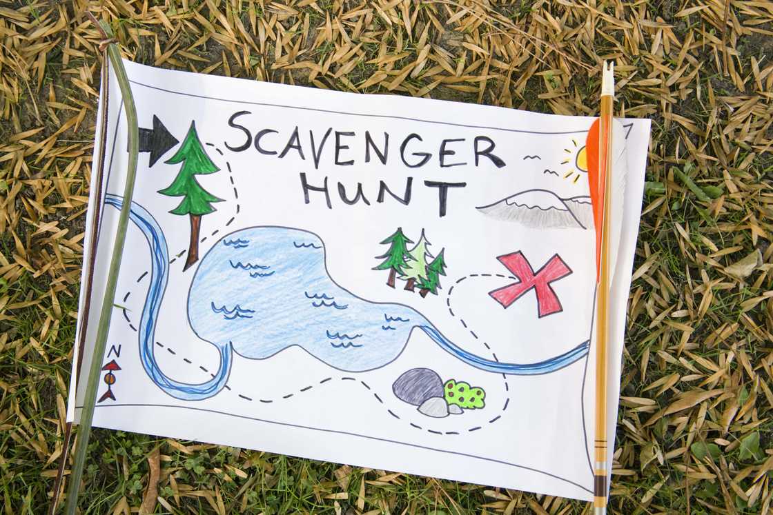 A colourful scavenger hunt map on the ground.