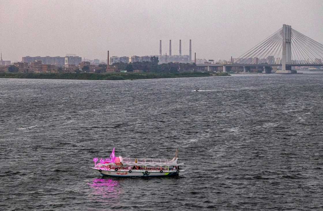 A leisure boat sails on the Nile south of the island of Warraq