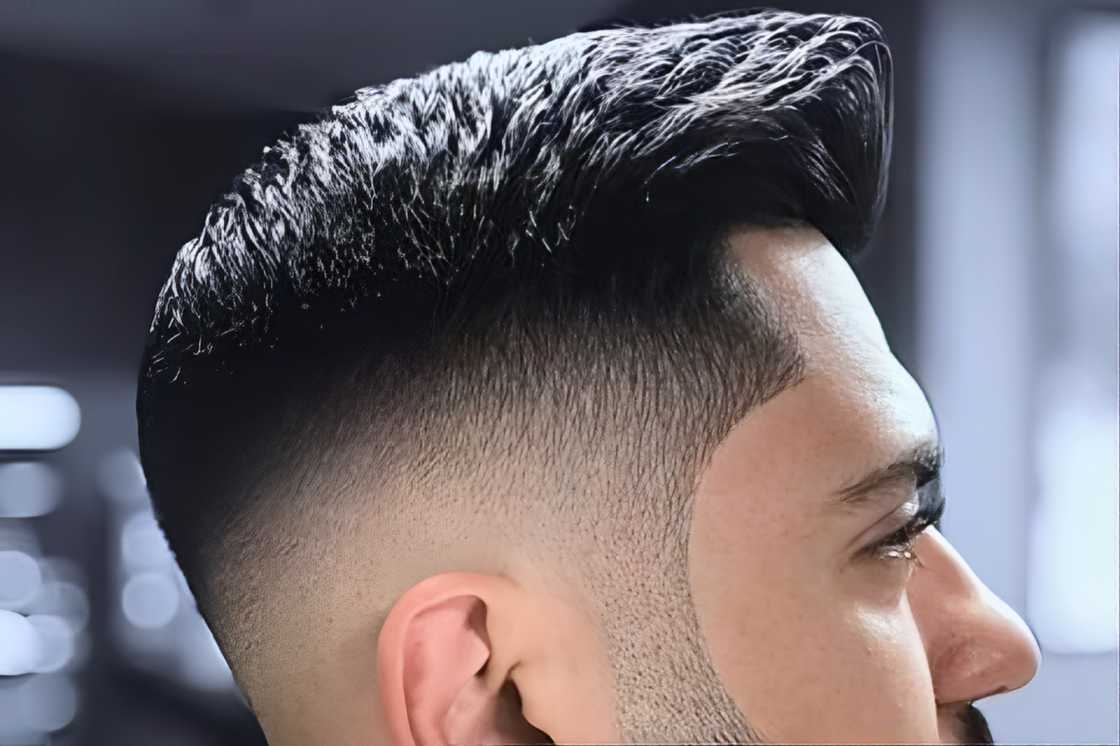 A white man is rocking a comb over drop fade with beards A white man is rocking a comb over drop fade with beards