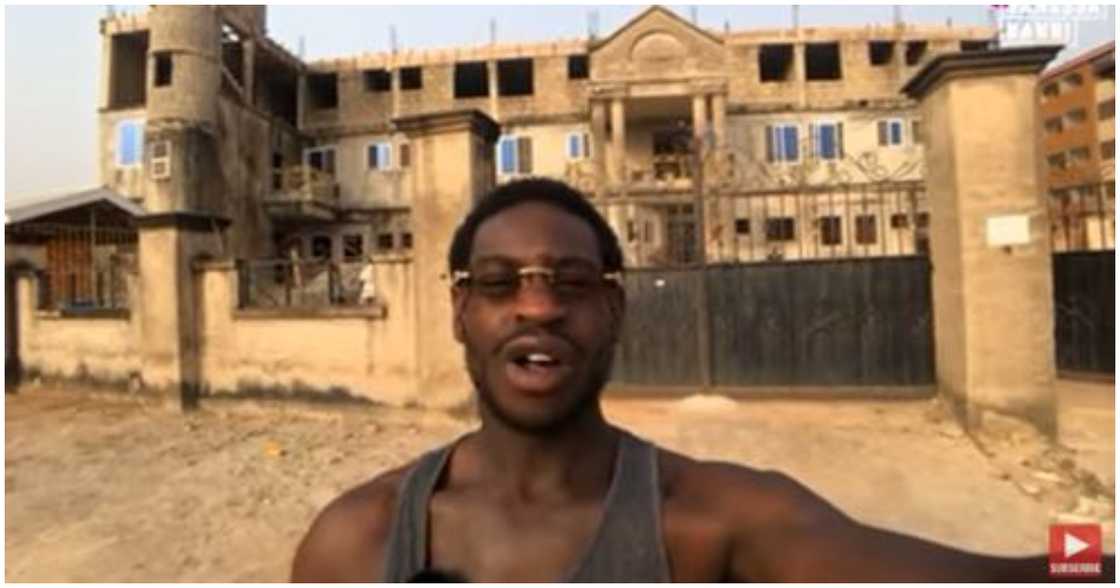 Kojo North takes a picture infront of the students' hostel he is building in Kumasi Kojo North takes a picture infront of the students' hostel he is building in Kumasi