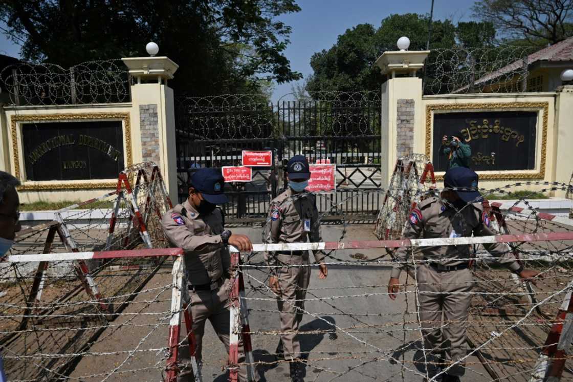 Prison officials prepare for the release of prisoners outside Yangon's Insein prison in February 2022