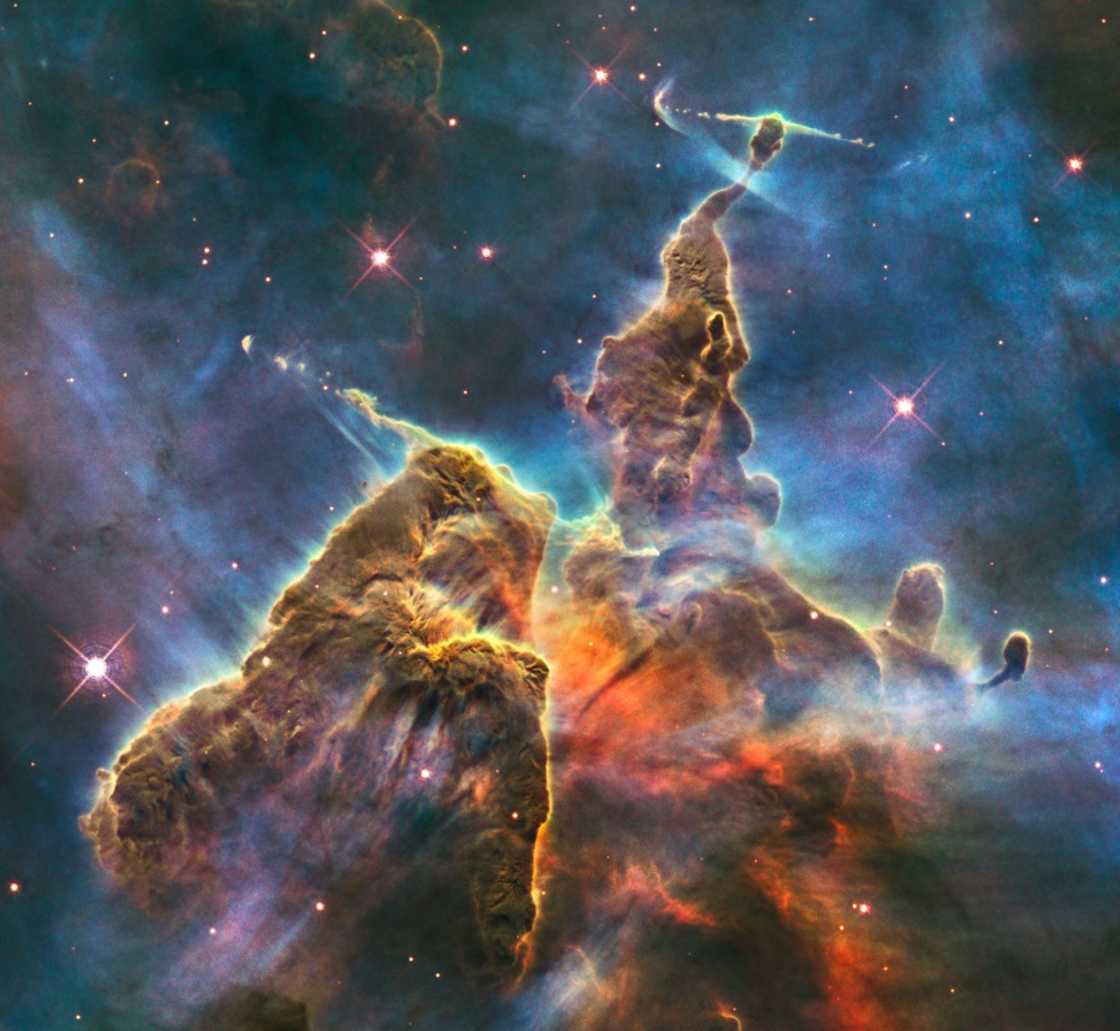 Carina Nebula is famous for its towering pillars that include "Mystic Mountain," a three-light-year-tall cosmic pinnacle captured in an iconic image by the Hubble Space Telescope, until now humanity's premier space observatory Carina Nebula is famous for its towering pillars that include "Mystic Mountain," a three-light-year-tall cosmic pinnacle captured in an iconic image by the Hubble Space Telescope, until now humanity's premier space observatory